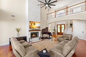 The inviting fireplace creates an intimate gathering setting.