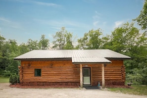 View of cabin and main entrance from driveway.