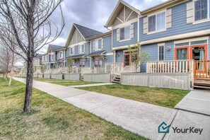 Lovely patio off the main living area and greenery out front. Free street parking makes it easy to park on either side of the home. 