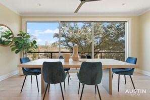 Gorgeous dining table and chairs near the sliding glass doors