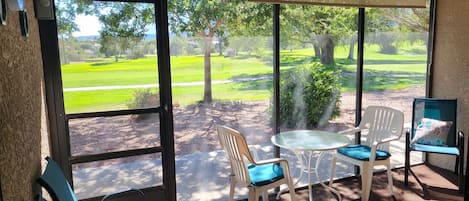 Inviting enclosed patio.  Great for work or relaxing.