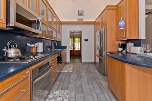 Spacious Fully Equipped Kitchen, Coffee Maker, Blender, Waffle Maker and More.
