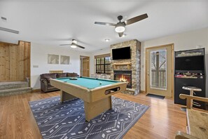 Full size pool table, classic arcade games, fireplace and Roku Tv