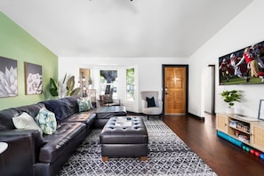 Catch a game or movie in the spacious living room with plenty of seating.