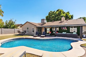 Soak up the Arizona sun and cool down under the covered patio with TV & BBQ.