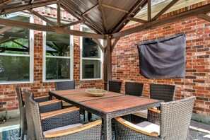 Covered table in the backyard to enjoy meals outside
