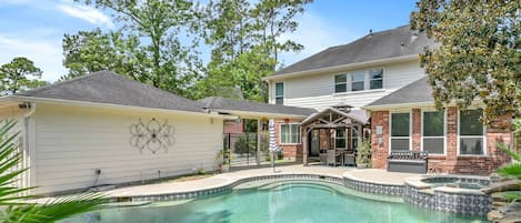 Enjoy a private pool and hot tub in the backyard