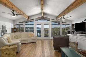 Relax in the living room, perfect for movie nights with a large TV.