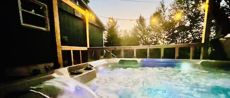 Relax in the new hot tub under the stars.