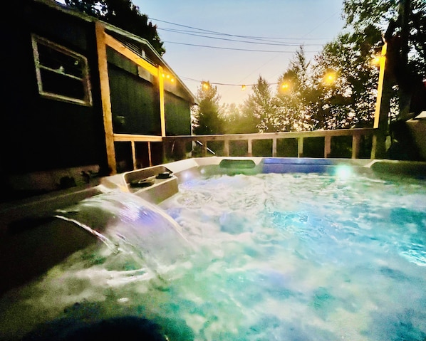 Relax in the new hot tub under the stars.