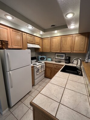 This roomy kitchen offers plenty of counter space for cooking large meals!