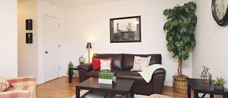 Living room with sleeper sofa, chairs, coffee table