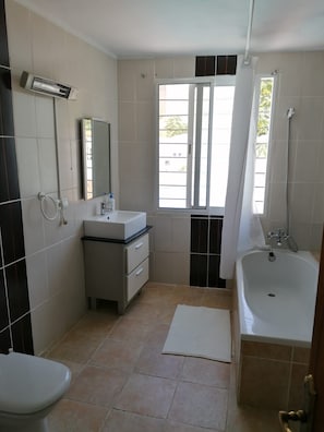En suite bathroom with full bath