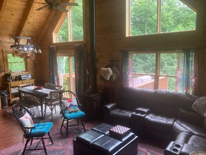 Main floor living room- There is a TV facing this sectional leather couch