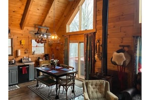 Dining and coffee station area, fireplace, outside sliding doors, is the hot tub