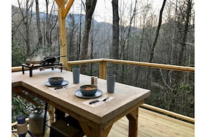 Dine al fresco in the trees in your outdoor kitchenette