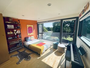 This bedroom, perched at the top of the house, feels like being in a treehouse.