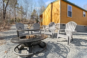 Enjoy the outdoors with a fire pit, attached grill, and picnic table!