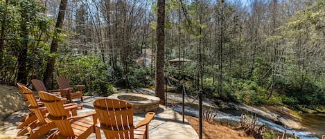 Large Stone Firepit next to the waterfall 
