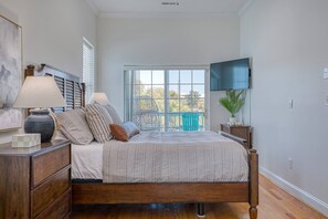 Watch tv or the OCEAN from the master bed on the main level