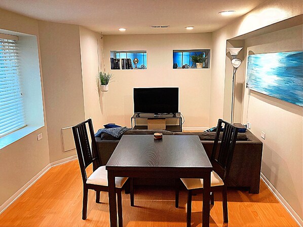 Relax in the comfortable sitting area with TV or at the dining table.