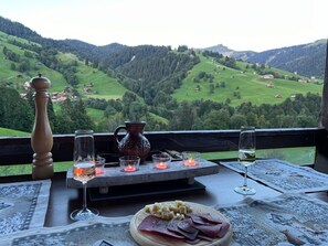 Food, Sky, Tableware, Mountain, Table, Window, Plant, Bottle, Outdoor Furniture, Leisure