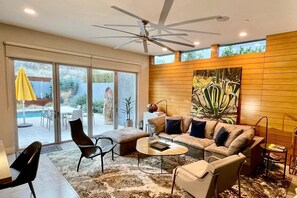 The great room with view to the backyard.  Includes an art television.  

