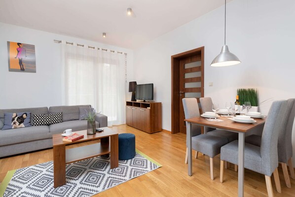 Living room with a comfortable sofa and TV. 