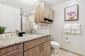Freshen up in the sleek bathroom with complimentary toiletries.