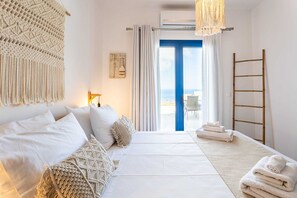 Bedroom with veranda access, perfect for morning coffee with a view.