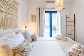Bedroom with veranda access, perfect for morning coffee with a view.