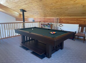 Loft area pool table and children's "play area"