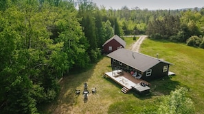Nestled in a private 8 acre lot surrounded by forest