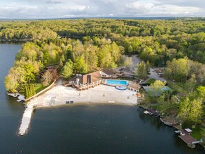 Our community’s lodge is at the edge of Roamingwood Lake. It  offers an outdoor heated pool, beach access, tennis courts and tiki bar!