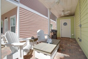 Covered patio with seating for six and Blackstone griddle.