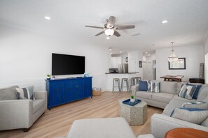 Elegant family room with 65” smart tv. 