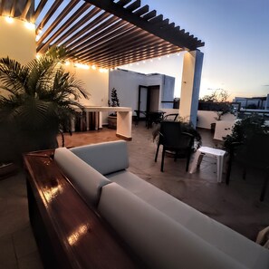 Wonderful private penthouse top patio. Quite evenings under the stars.