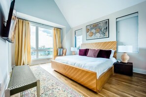 Primary bedroom with King bed, smart TV, and en-suite bathroom.
