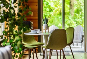 Dining Nook: Bright and inviting space to share meals and memories with nature as your backdrop!