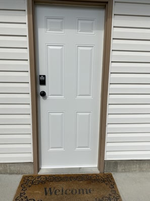 Side entrance door with code lock..