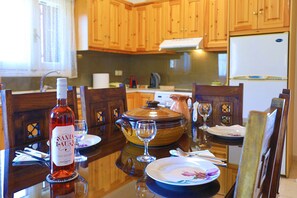 Dining table%2C wine%2C crockpot and fridge