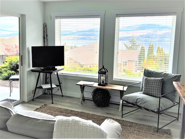 Living room with a lake and vineyard view