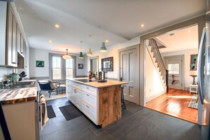 Entry into kitchen. Induction stove top, with plenty of storage, Great workspace