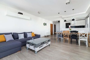 Living room with a dining table