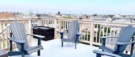 Rooftop deck with Adirondack chairs