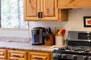 Fully stocked kitchen with gas stove