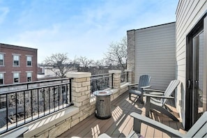 Terrace features 4 comfortable polywood chairs, outdoor end tables, small fire table, and 2 additional outdoor seating in the alcove set back. You will be amazed by the beauty of the hand cut stone work and the privacy the loft level affords.