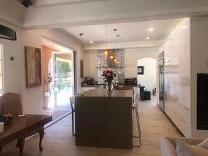 Modern kitchen, opens up to the patio