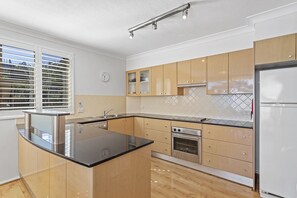 Fully equipped kitchen, enjoy cooking while checking out the amazing views.