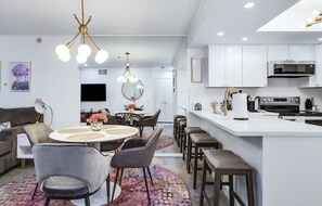 Dining for 4 plus 3 counter stools. All new lighting throughout. Super clean! 